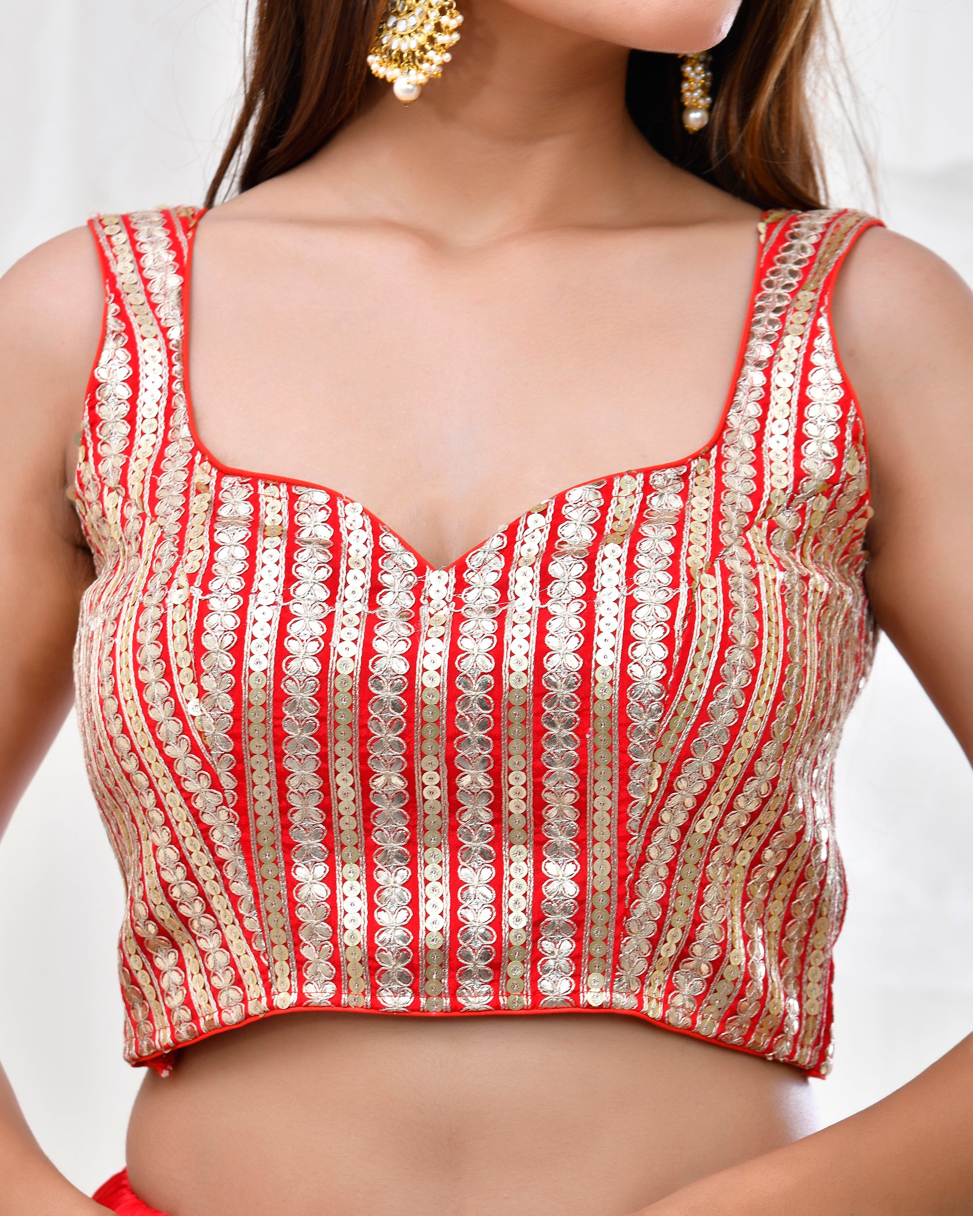 Red Sleeveless Padded Blouse with Gold Detailing
